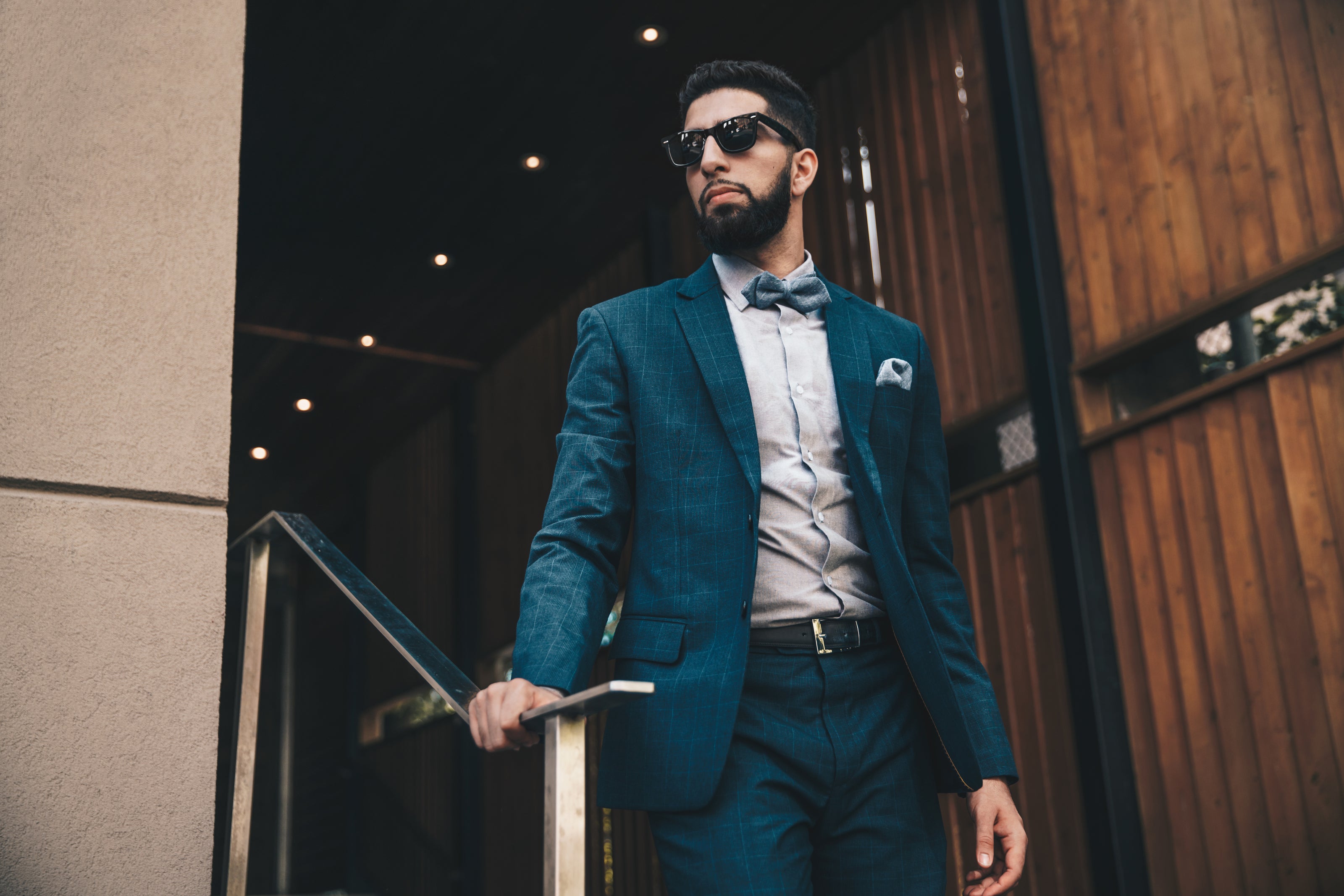 man-in-suit-on-stairs